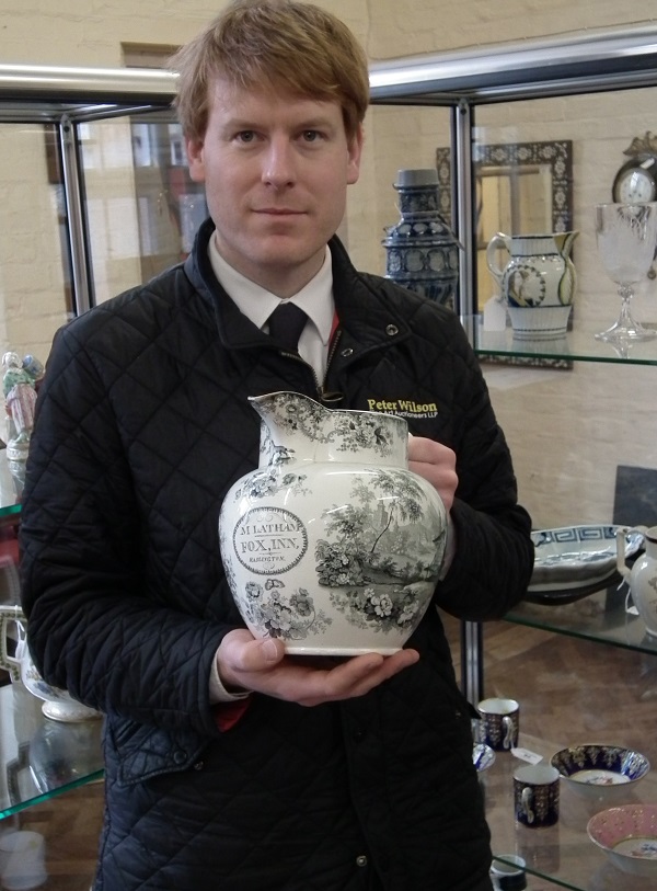 Chris Large of Peter Wilson auctioneers with Haslington jug
